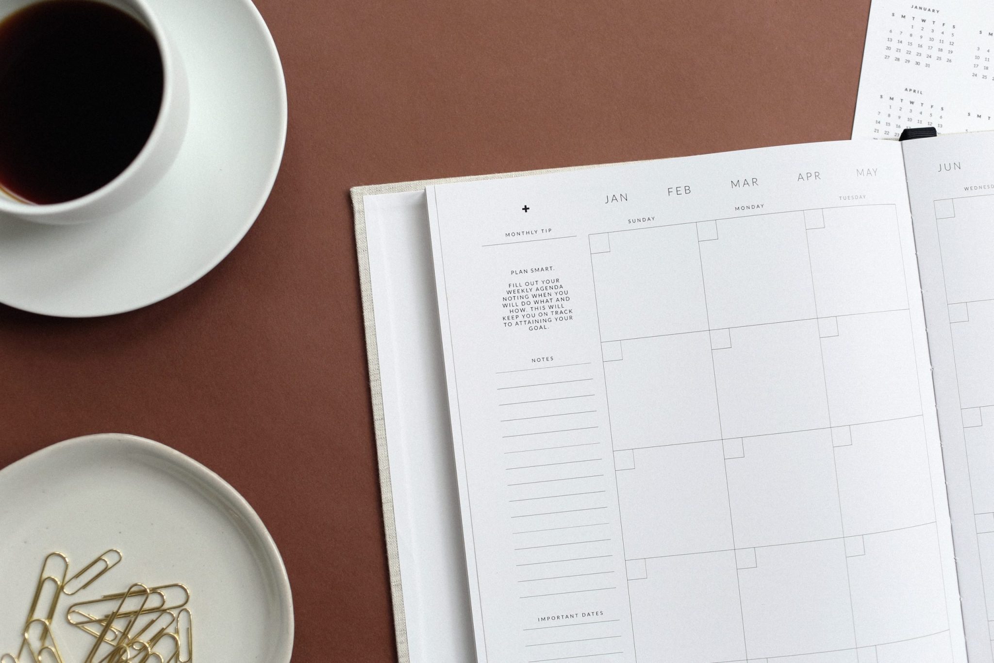 Photo by NORTHFOLK flat lay photography of book and teacup